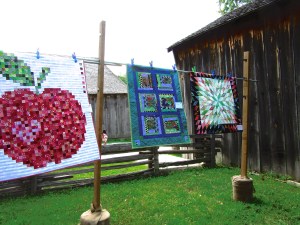 Quilts on display outdoors at Black Creek Pioneer Village